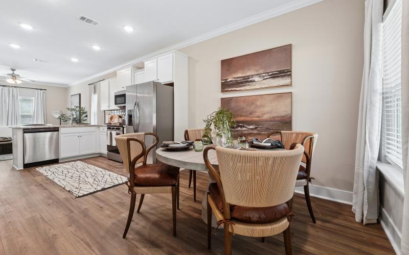 a kitchen with a dining table and chairs