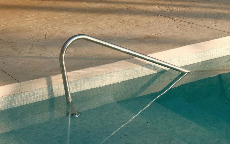 a pool with chairs around it