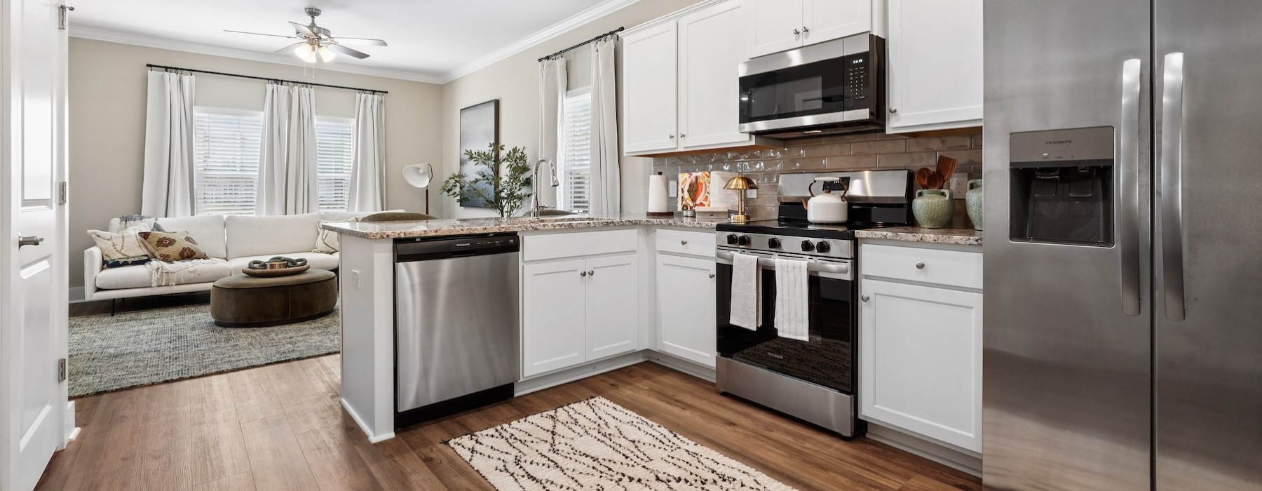 a kitchen with white cabinets