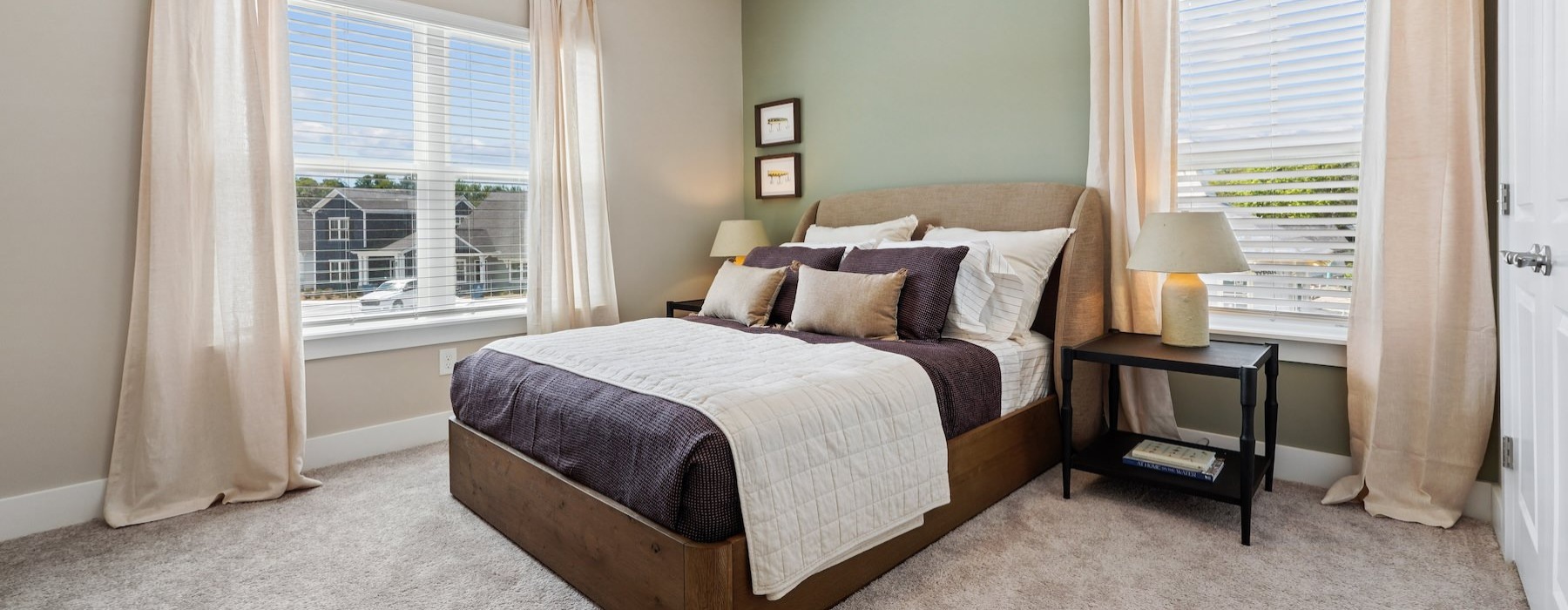 a bedroom with a bed and two nightstands