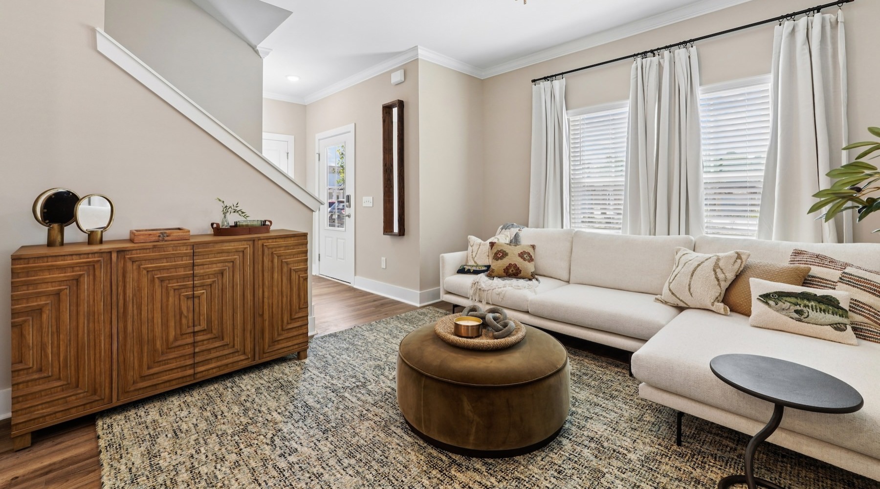 a living room with a couch and tables